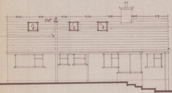Architectural elevation drawing showing a two-story house with proposed roof lights and a chimney stack. The sketch details the installation of new windows for an attic conversion.