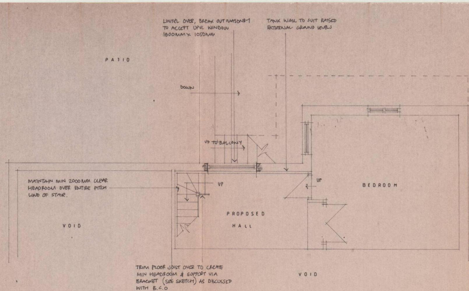 Architectural floor plan showing internal layout with a proposed hall, bedroom, and patio area, including structural annotations for stairs and voids.