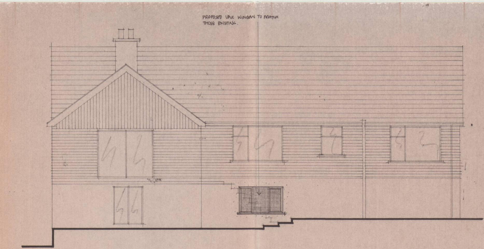 This is an architectural elevation drawing showing the rear facade of a building with horizontal cladding and a chimney. It highlights a proposed window installation to match existing ones, indicating alterations to t...