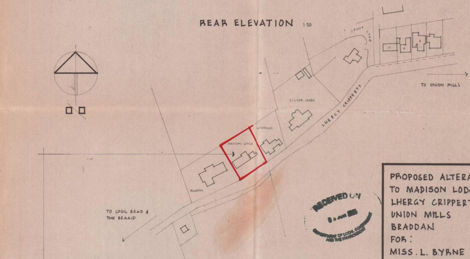 The image displays a hand-drawn site location plan highlighting the property 'Madison Lodge' in red ink, situated on Lhergy Cripperty in Braddan. It shows surrounding neighboring properties and includes an official 'R...