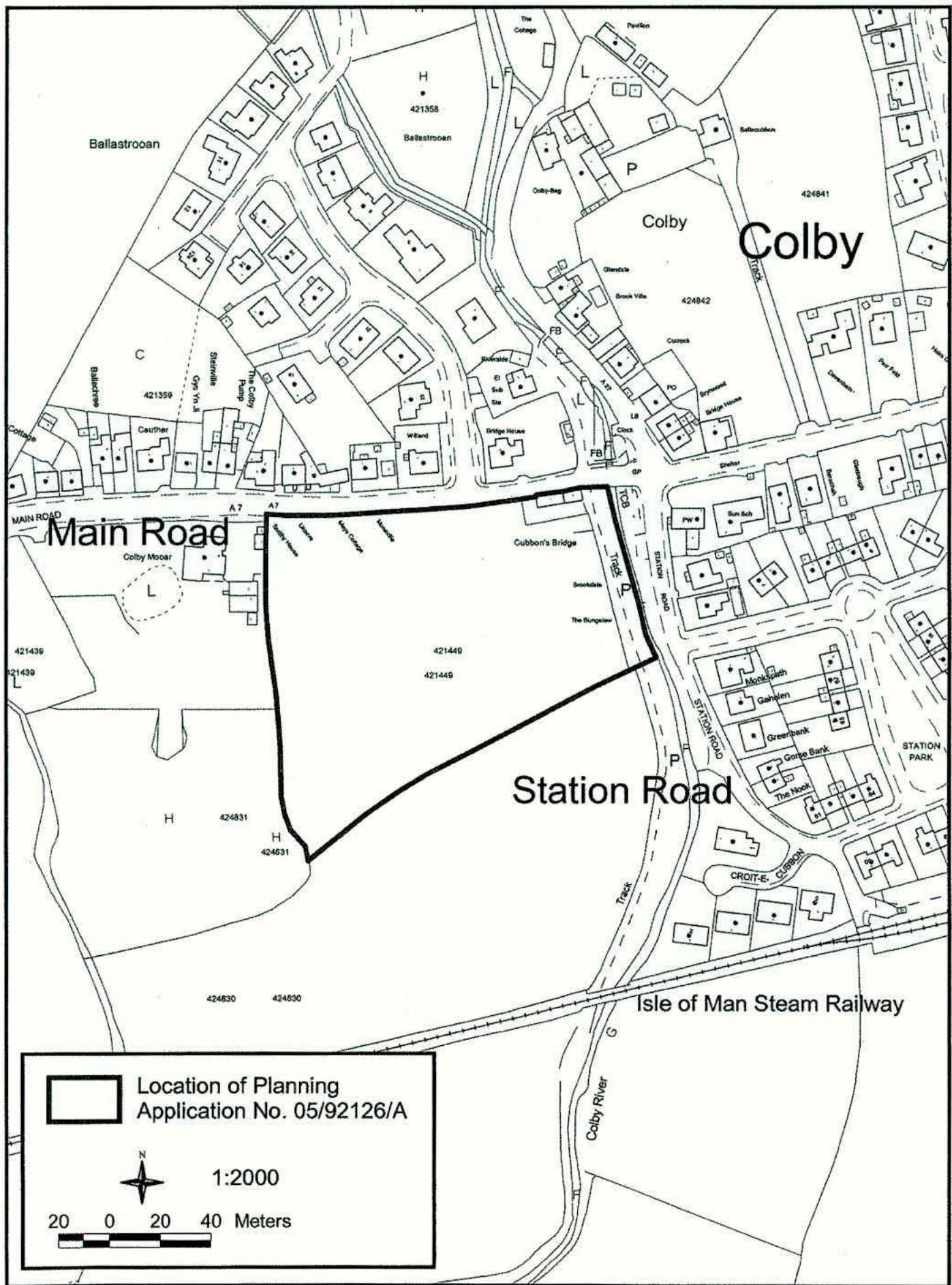 A black and white site location map highlighting a specific plot of land with a thick black boundary line near Main Road and Station Road in Colby.