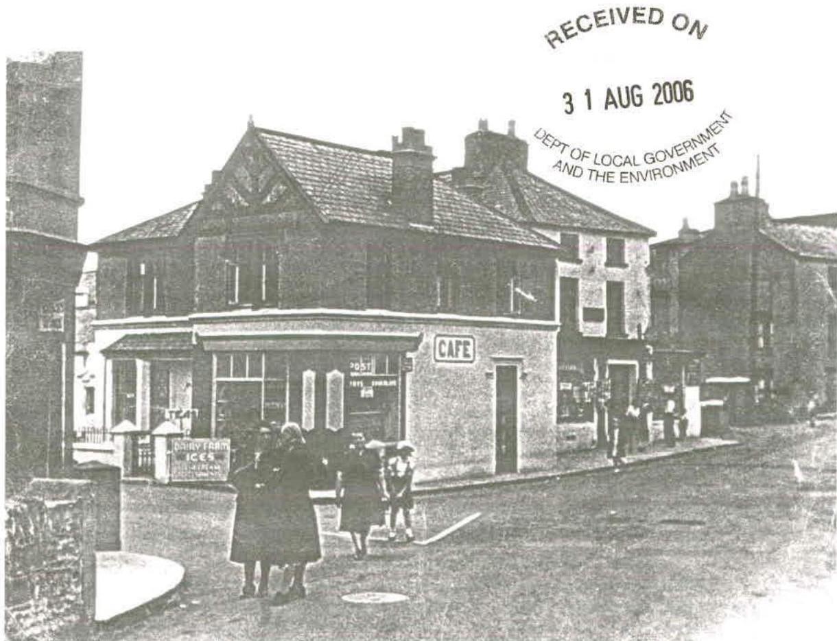 A black and white photograph showing a corner building with a 'CAFE' sign on the ground floor and people standing on the pavement. A 'RECEIVED ON 31 AUG 2006' stamp is visible in the top right corner.