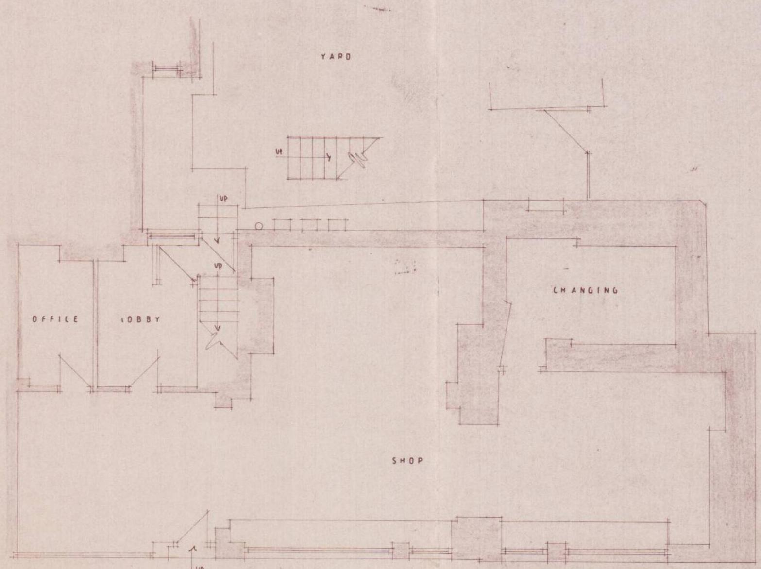 This image displays a faded architectural floor plan of a commercial property layout. It shows labeled rooms including a shop, office, lobby, and changing area, along with staircases and a yard.