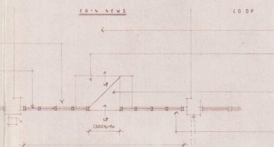 Architectural detail drawing showing a shop front elevation section with dimensions and text labels like 'ERIN NEWS'.