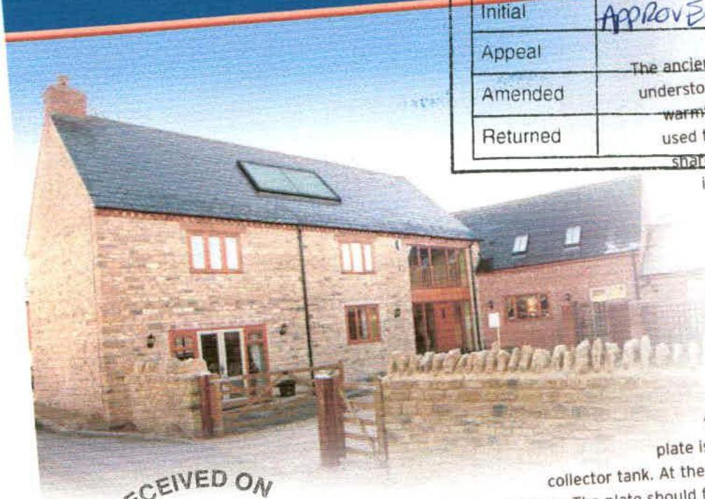 A photograph of a stone building with a slate roof featuring a solar panel installation, partially overlaid by a planning approval table.