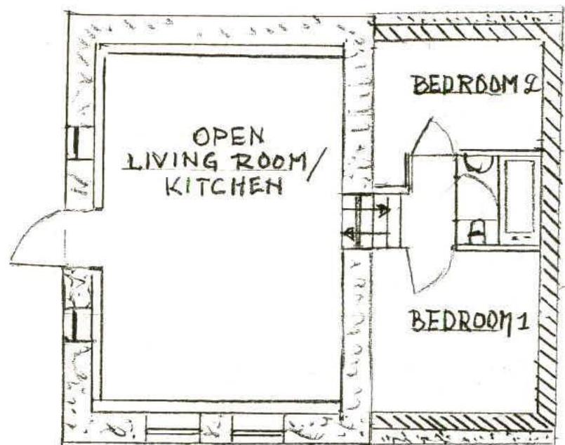 A hand-drawn architectural floor plan showing the layout of a converted barn with an open living room/kitchen and two bedrooms.