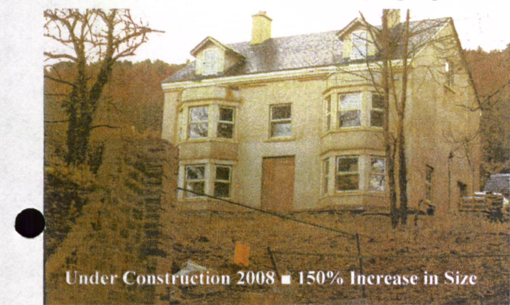 A photograph of a large, two-story detached house under construction, featuring prominent bay windows and a chimney. The image includes text overlay stating 'Under Construction 2008' and '150% Increase in Size'.