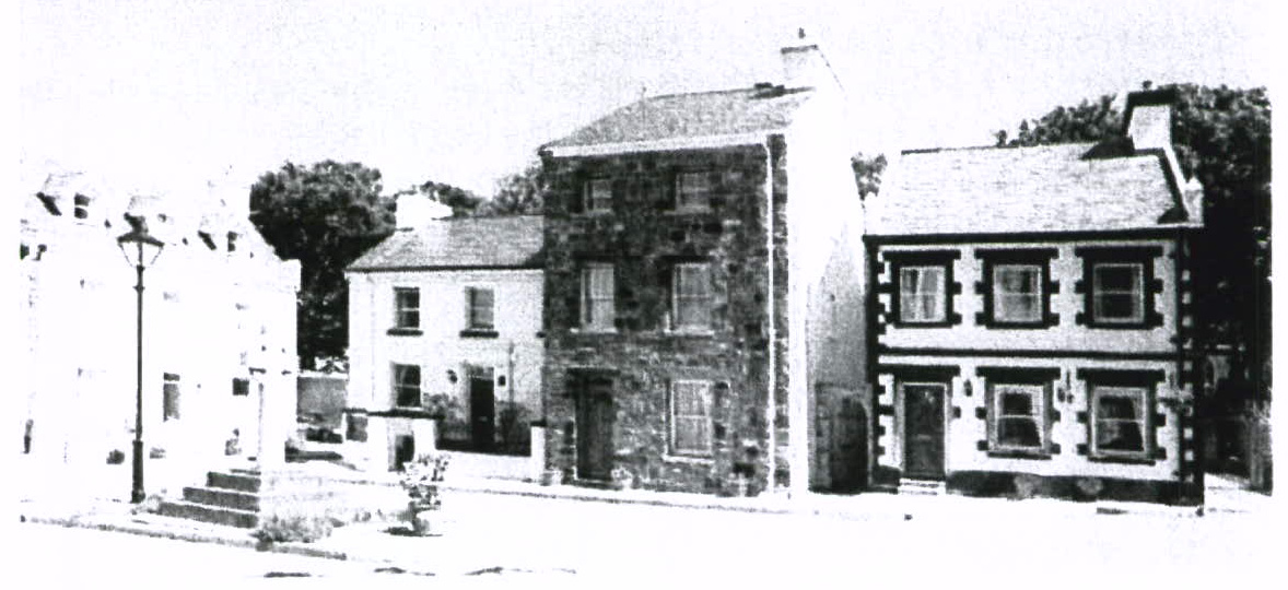 A grainy black and white photograph showing a row of traditional stone and rendered buildings along a street with a lamp post.