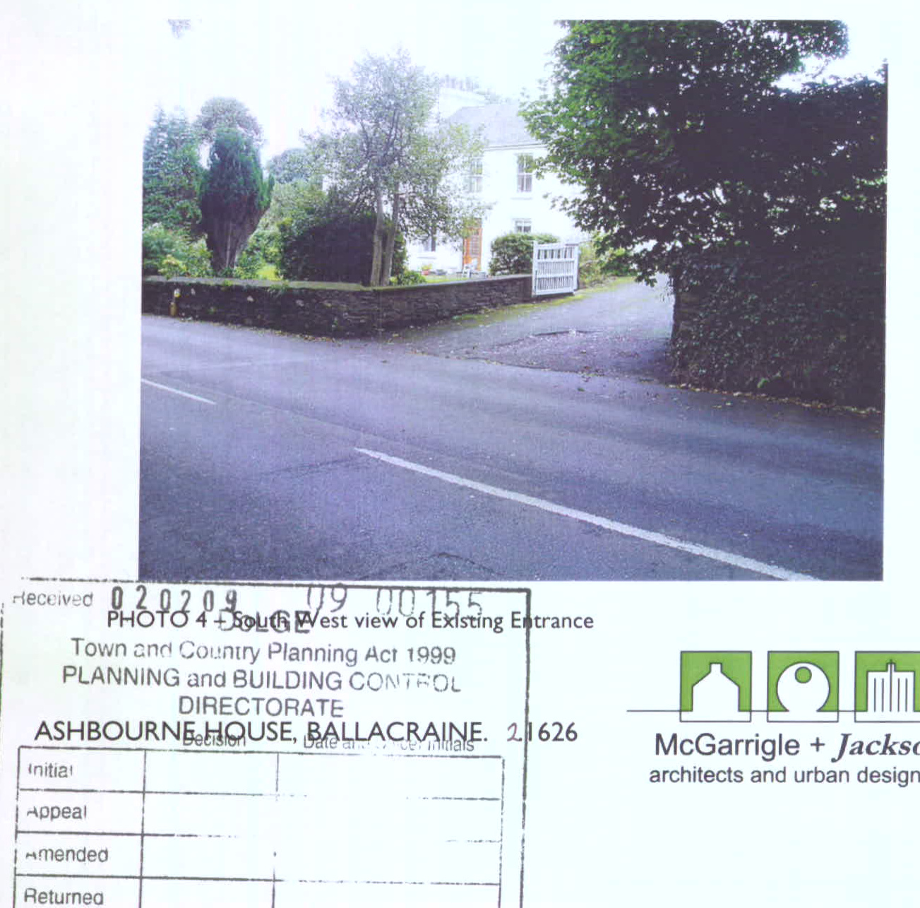A scanned document page featuring a photograph labeled 'PHOTO 4 - South West view of Existing Entrance' showing a white house, driveway, and road, accompanied by a planning application receipt stamp.