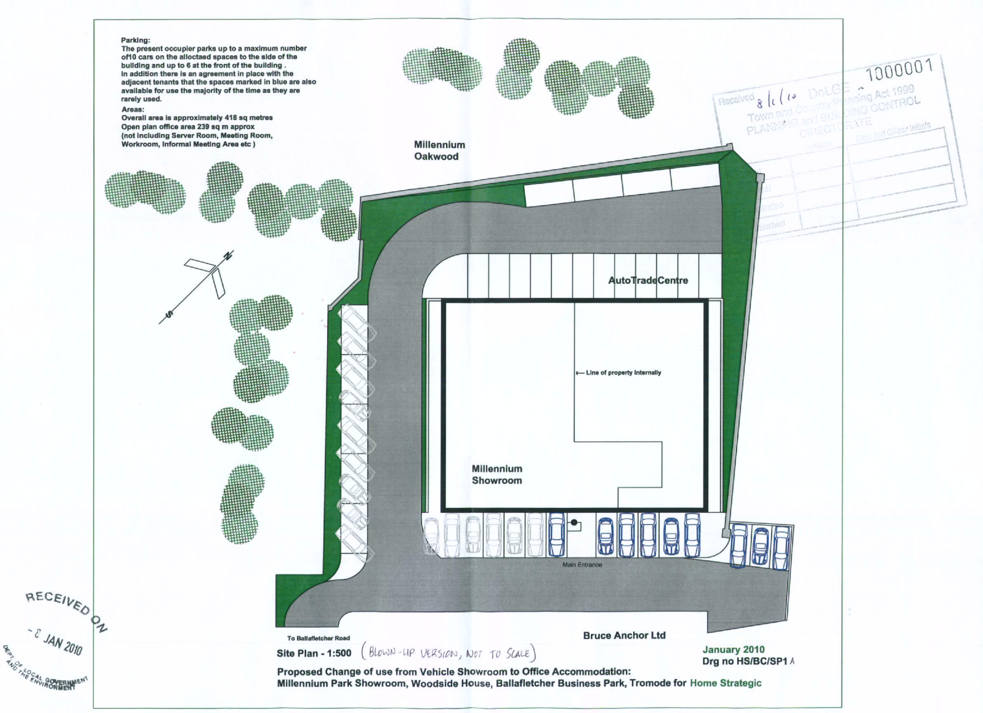 This is a 1:500 scale site plan showing the layout of the Millennium Showroom and Auto Trade Centre, including parking spaces, landscaping, and access roads.