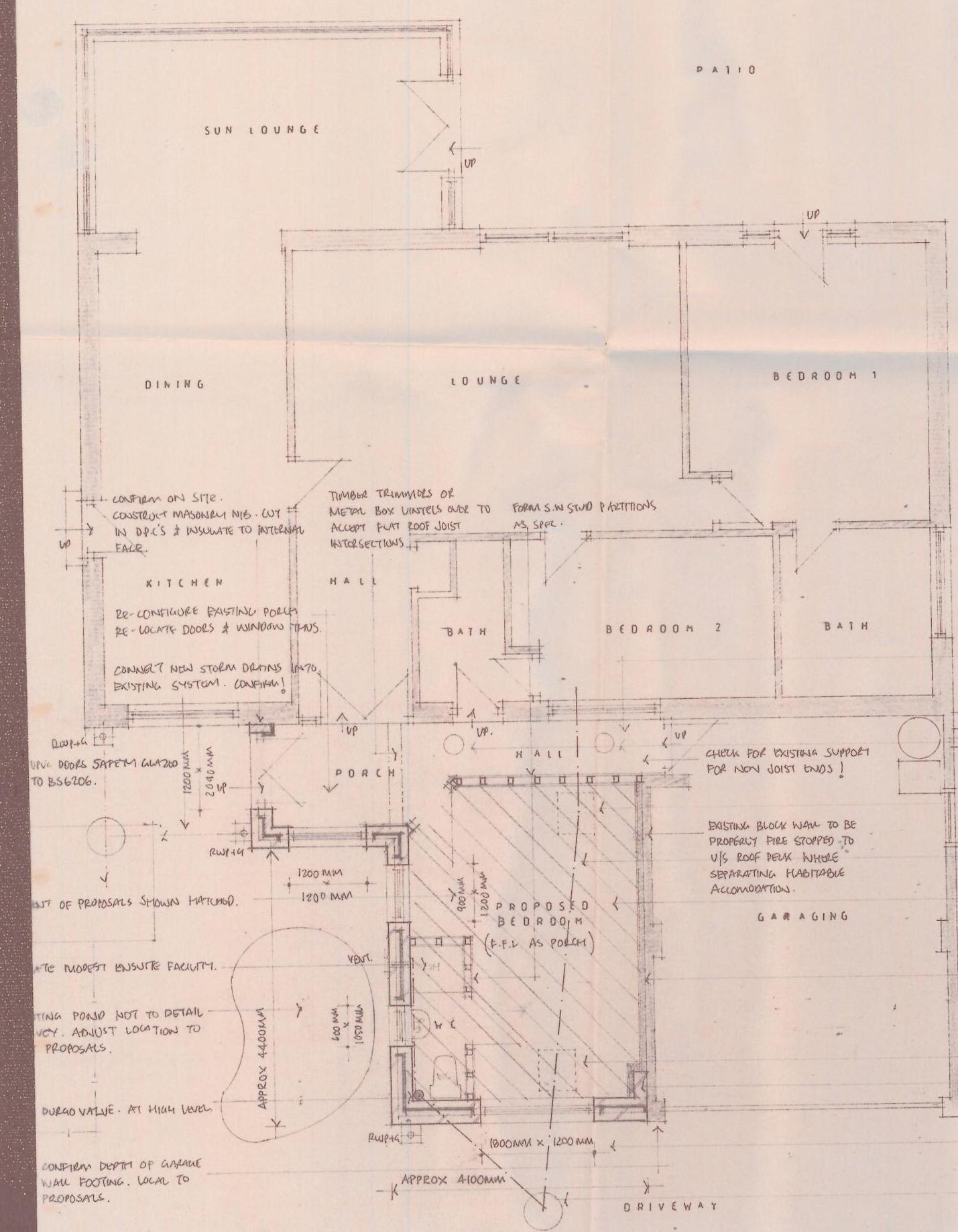 This image displays a detailed architectural floor plan for a residential extension, showing room layouts like a proposed bedroom and garage.
