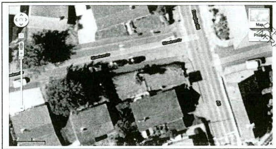 Aerial map view showing a street intersection with rooftops, trees, and visible street names like Glencoe Rd.