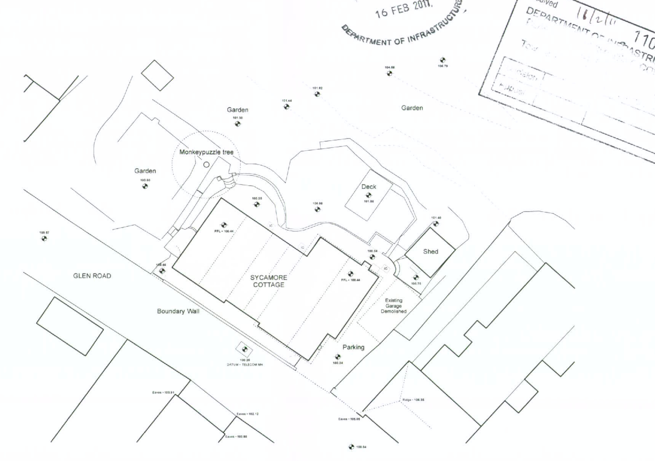 A black and white site plan showing the layout of Sycamore Cottage on Glen Road, including a new extension footprint, a deck, a shed, and a demolished garage location.