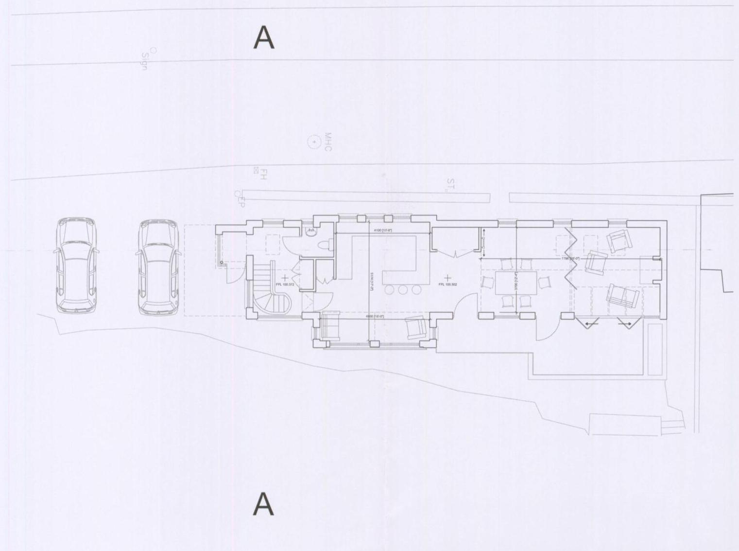 Architectural floor plan showing the layout of a replacement dwelling with internal rooms and external parking spaces for two vehicles.