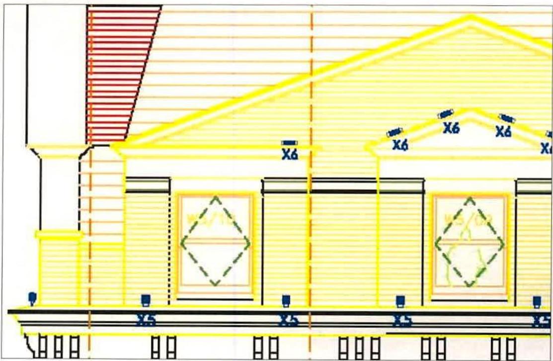 An architectural elevation drawing illustrating the proposed installation of external lighting fixtures on a building facade, with yellow highlights indicating placement.