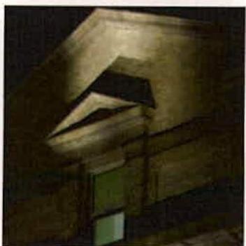 A night-time photograph showing an external wall light fixture illuminating the corner of a building.