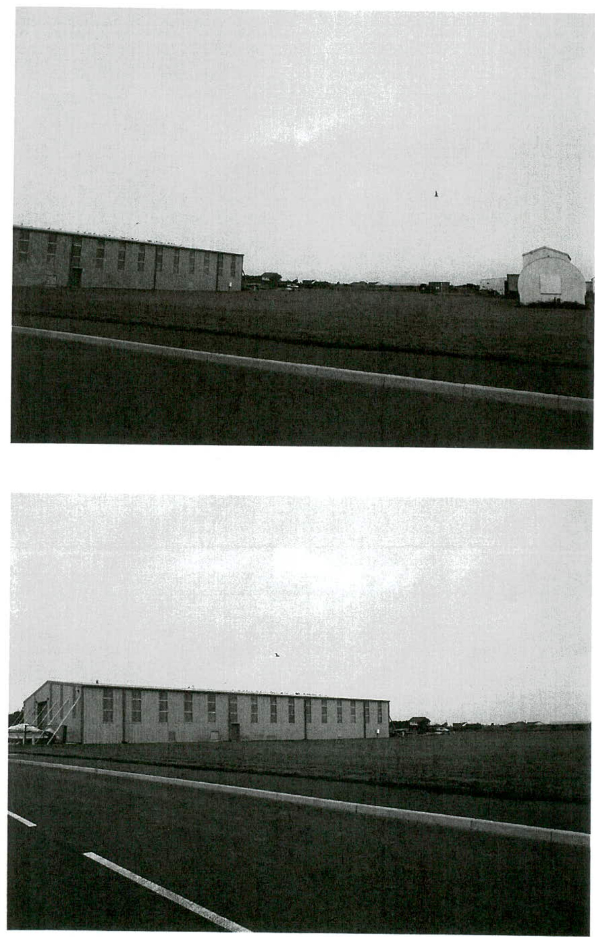 Two black and white photographs showing a long, single-story industrial or agricultural building situated next to a paved road.
