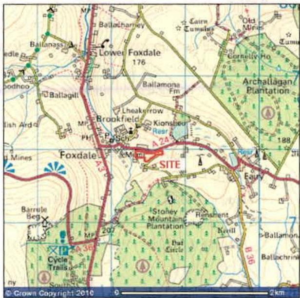 This is a site location map showing the proposed development area marked in red near Foxdale. It displays surrounding roads, buildings, and topographical features like plantations.