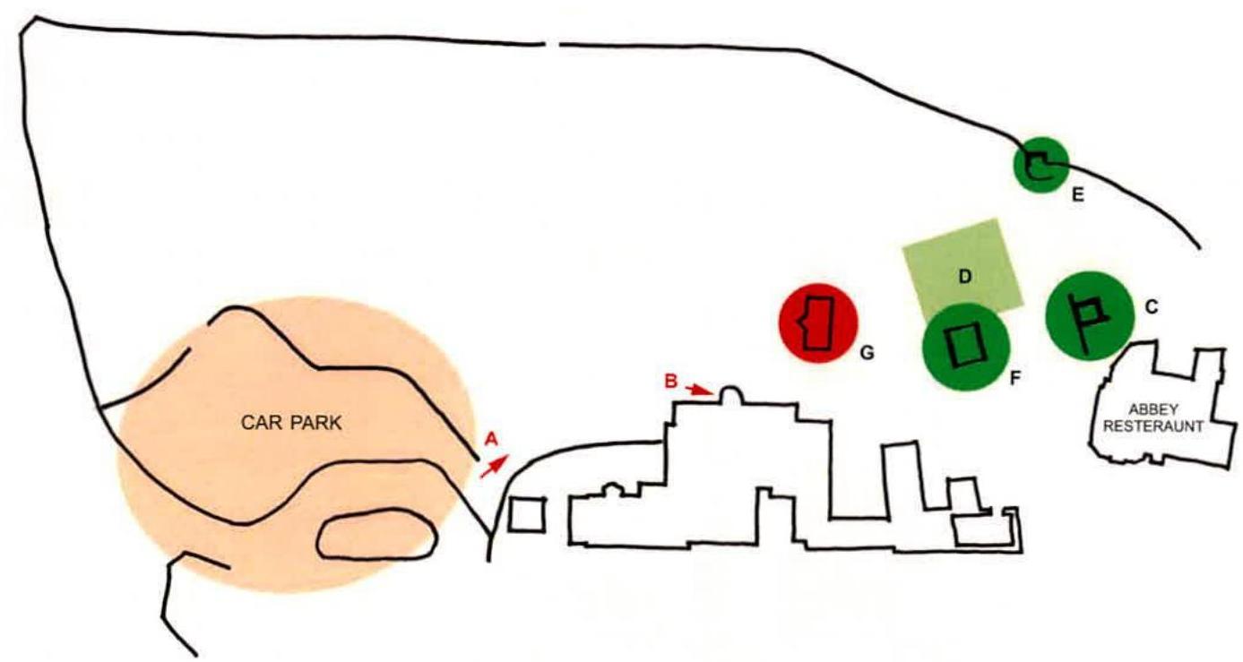 A hand-drawn site plan illustrating a car park area, existing buildings like the Abbey Restaurant, and proposed colored shapes indicating new structures or landscaping.