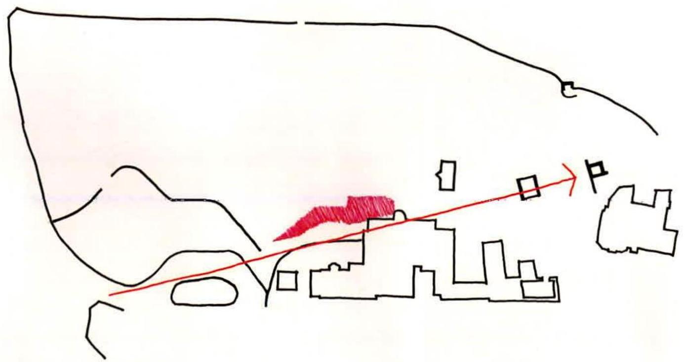 A hand-drawn sketch site plan showing building outlines, a red shaded area indicating the proposed cabin, and a parking symbol with an access arrow.