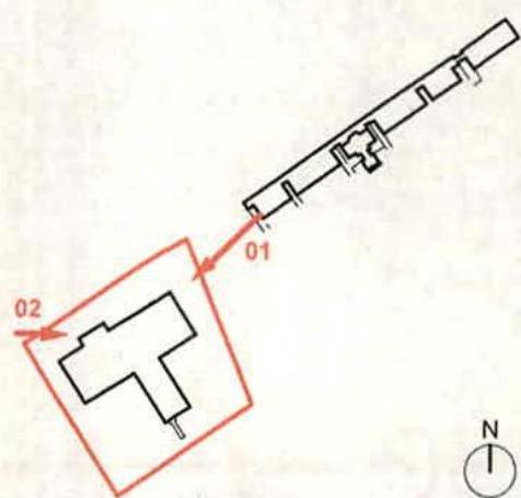 A schematic site plan showing two building footprints outlined in red with numbered callouts and a north arrow.