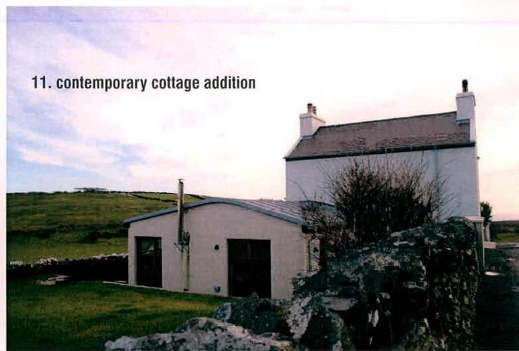 A perspective view showing a white cottage with a new single-story extension attached, set in a rural landscape with a stone wall in the foreground.