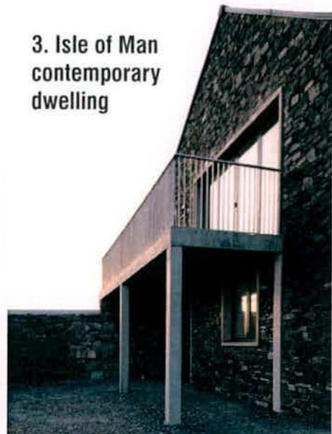 A photograph showing a stone building with a modern cantilevered balcony, labeled 'Isle of Man contemporary dwelling'.