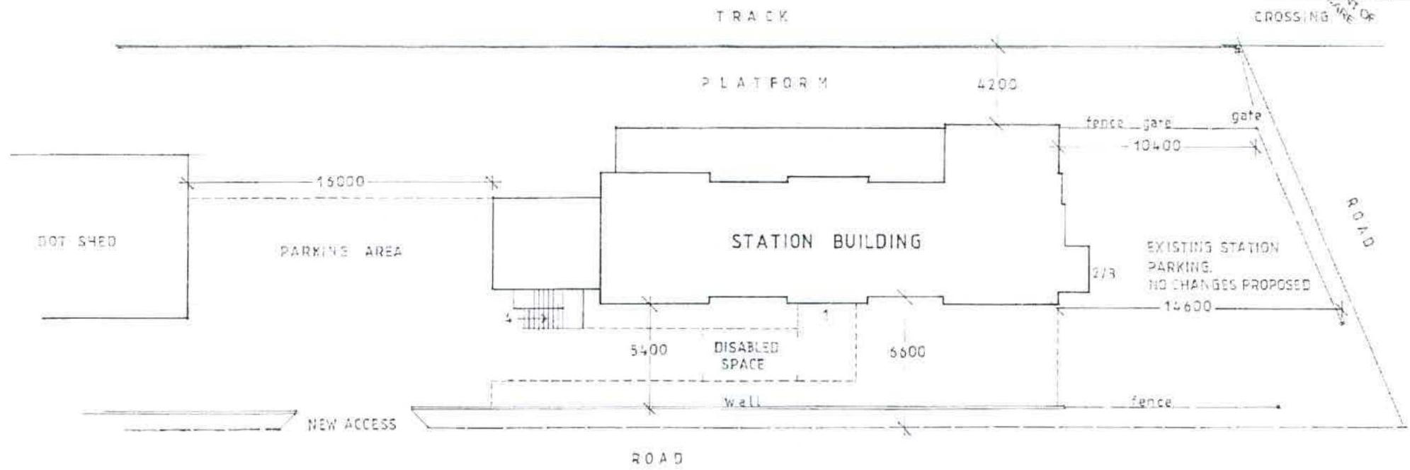 Technical site plan showing the layout of the railway station building, parking area, and access points with dimensions.