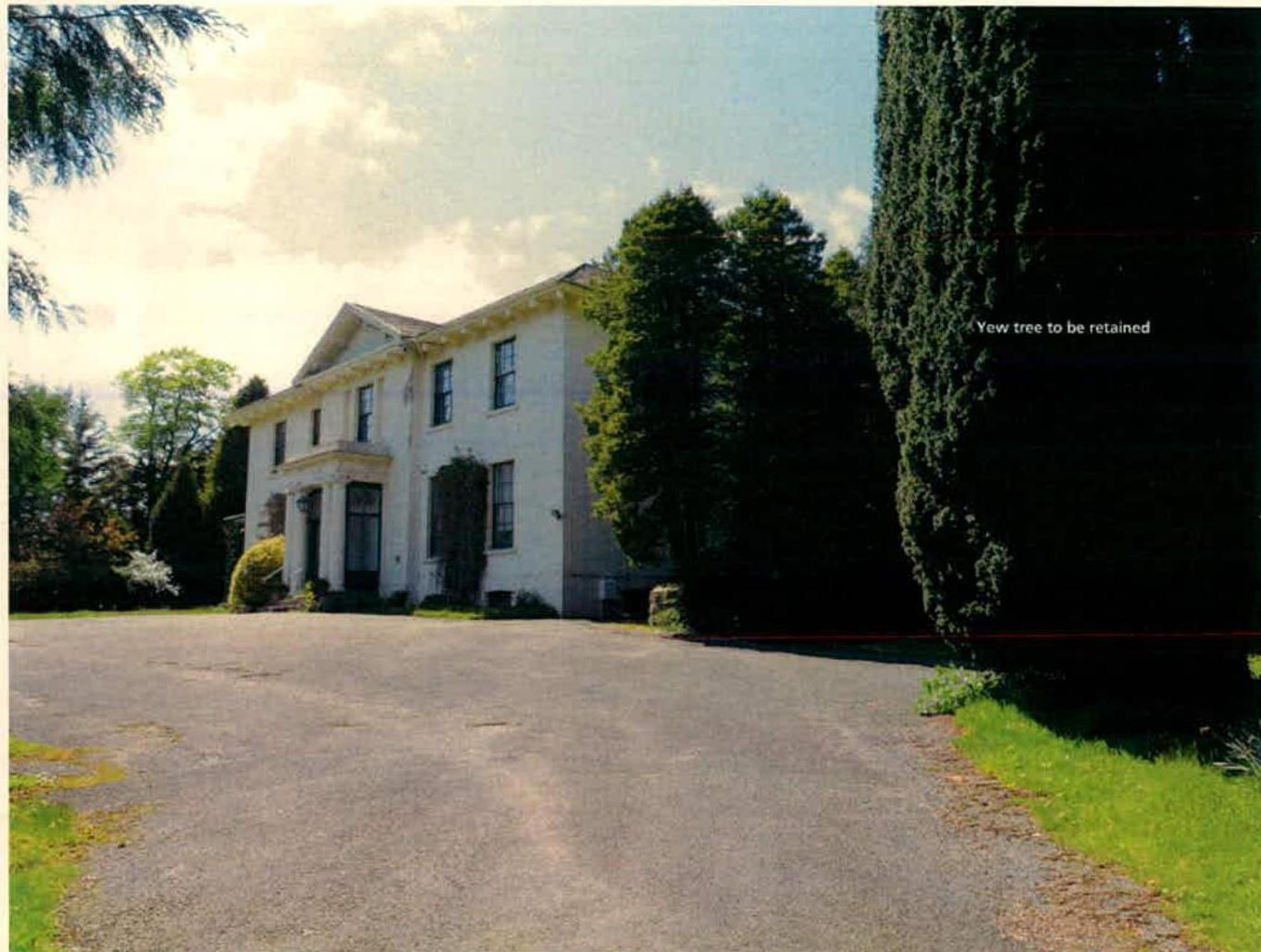 A photograph showing the existing front façade of a large white detached house with a driveway and mature trees, annotated with a note about a yew tree to be retained.