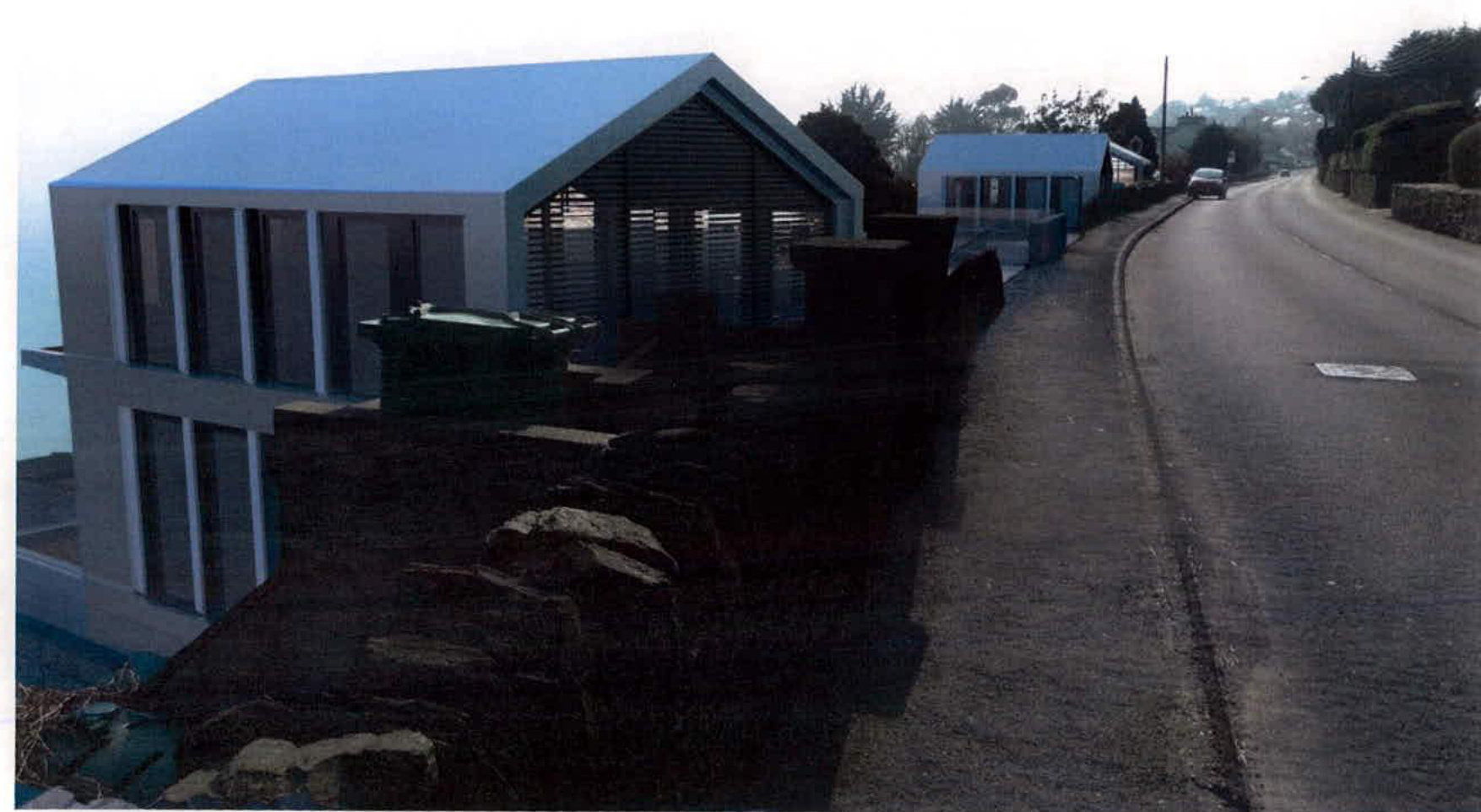 A photograph of a physical scale model depicting the proposed detached dwellings situated alongside a road.