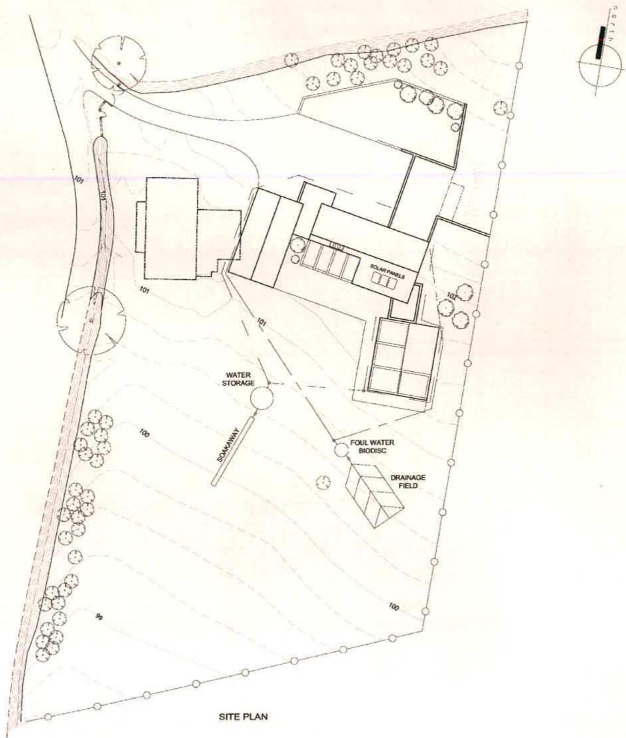 A technical site plan illustrating the layout of a property with a new dwelling, solar panels, and various drainage infrastructure components.