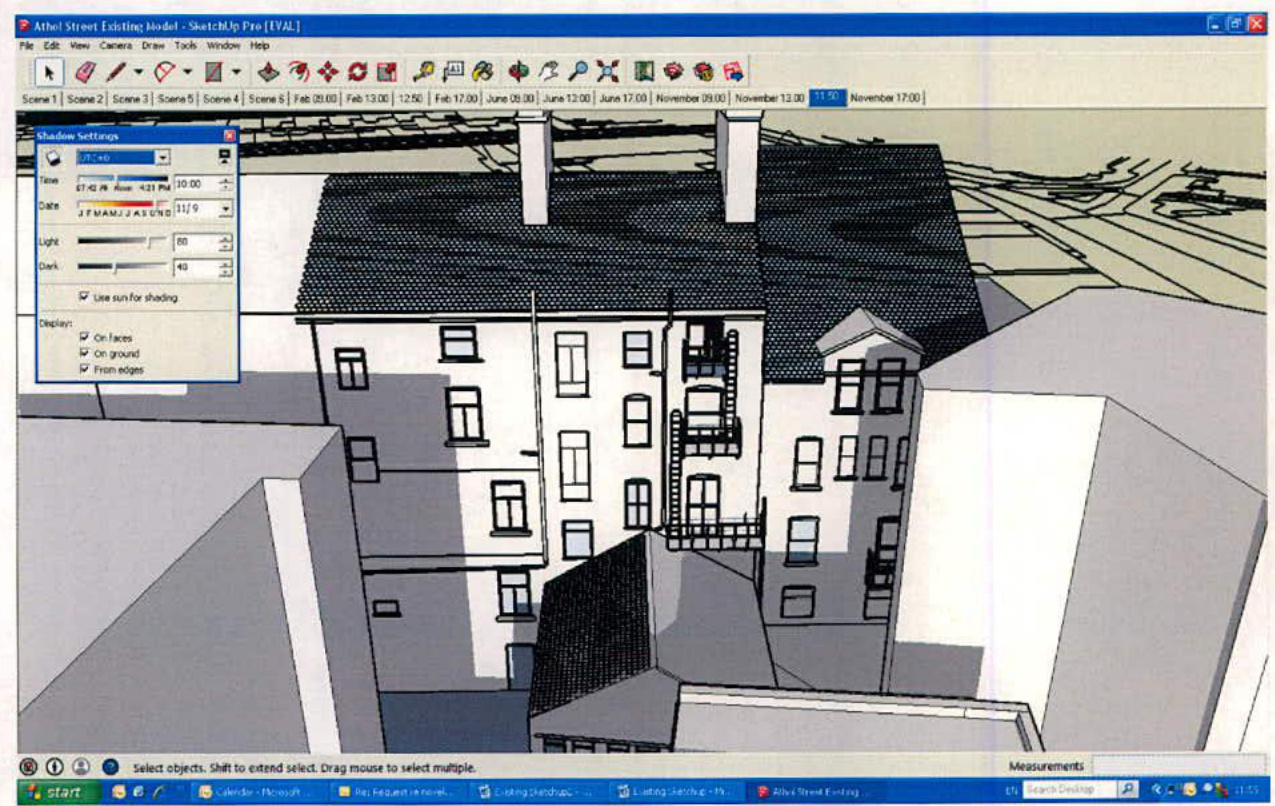A screenshot of a SketchUp 3D model showing a multi-story building with a dark roof and white facade.