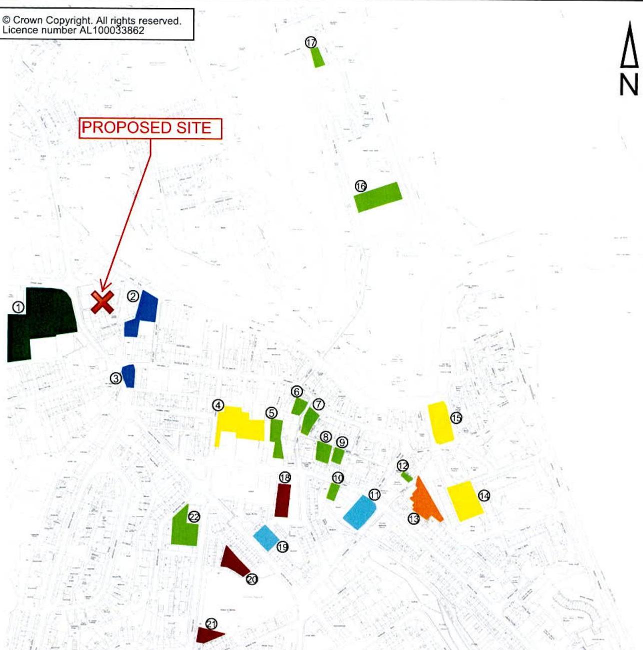 A location map showing the proposed development site marked with a red cross and arrow, overlaid on a street plan with surrounding properties highlighted in various colors.
