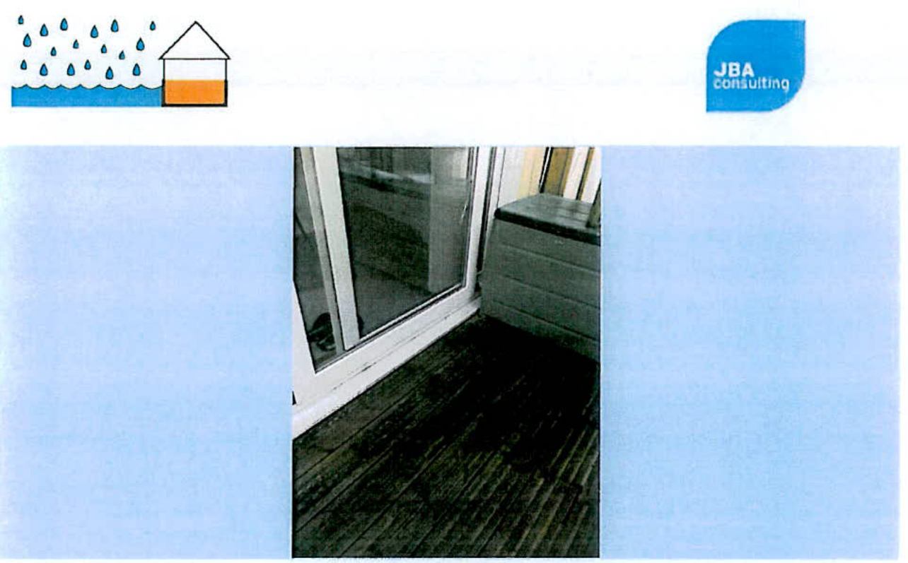 A document page from JBA Consulting featuring a flood risk schematic diagram in the header and a photograph of a white patio door threshold on dark decking.