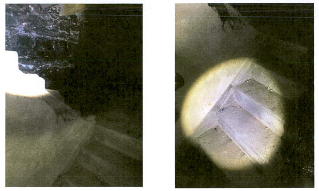 Two dark, grainy interior photographs showing rough stone or concrete walls illuminated by a focused light source, likely documenting existing conditions for refurbishment.