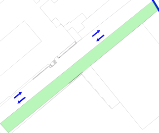 A schematic site plan showing a proposed one-way traffic system with blue arrows indicating direction on a highlighted green road section.