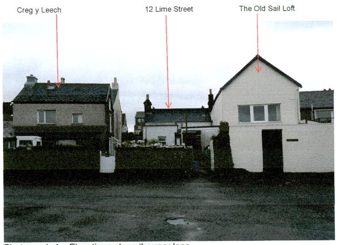 A photograph showing a street view of three residential properties labeled with red arrows, including 'The Old Sail Loft' and '12 Lime Street'.