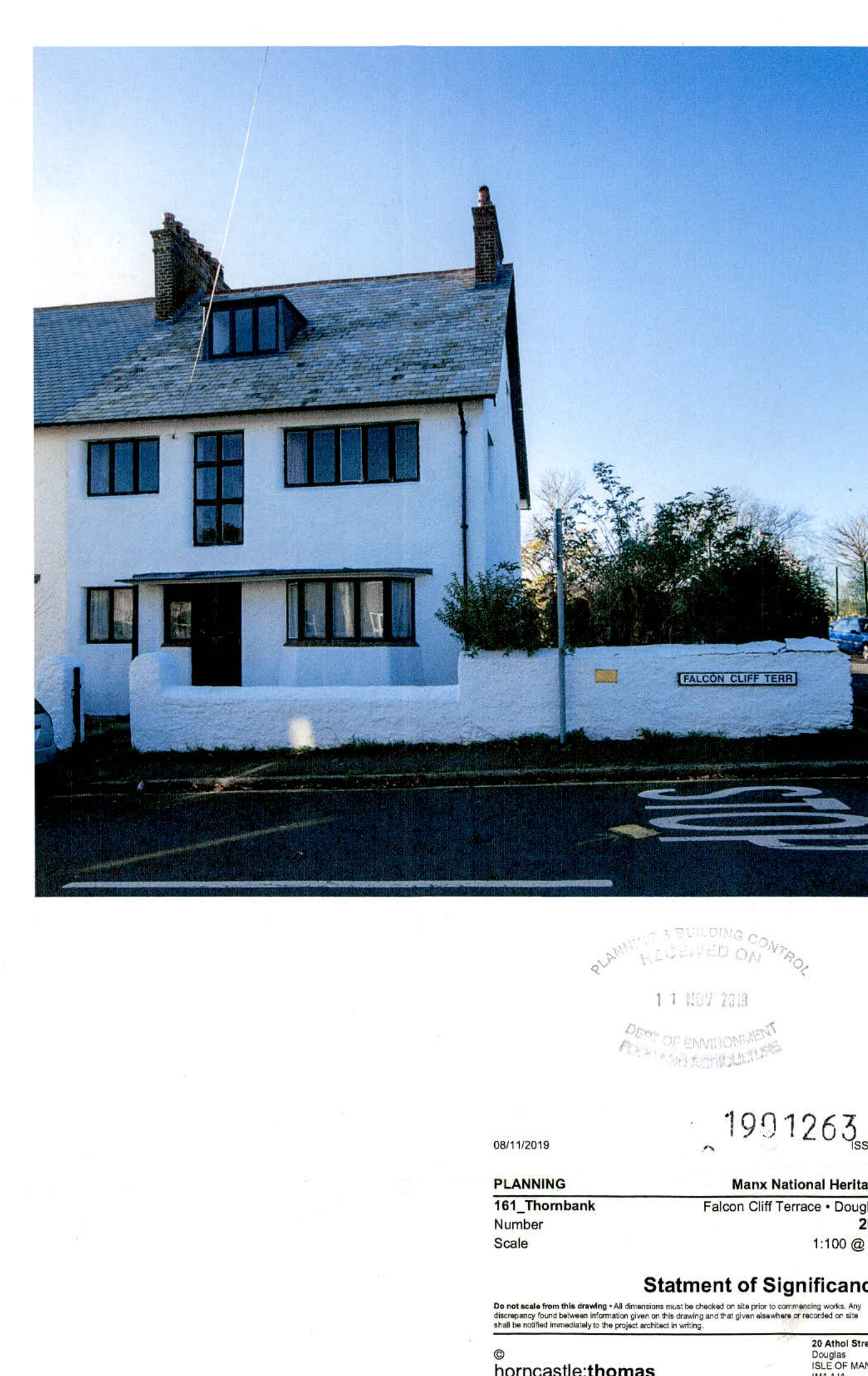 The image shows a photograph of a white, two-story terraced house with a slate roof and chimneys, situated behind a white boundary wall with a street sign reading 'Falcon Cliff Terr'. The bottom section displays a doc...