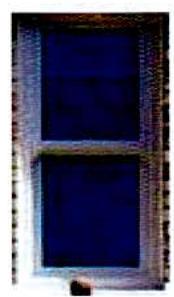 A close-up photograph of a white uPVC window frame with two rectangular panes, likely showing the existing or proposed replacement window.