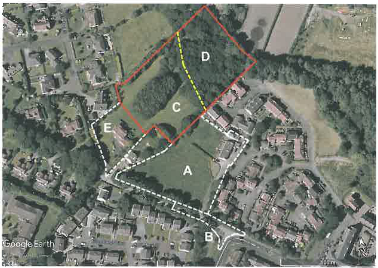An aerial view site plan showing a large plot of land divided into sections A through E, outlined in red and white dashed lines, surrounded by existing residential housing.
