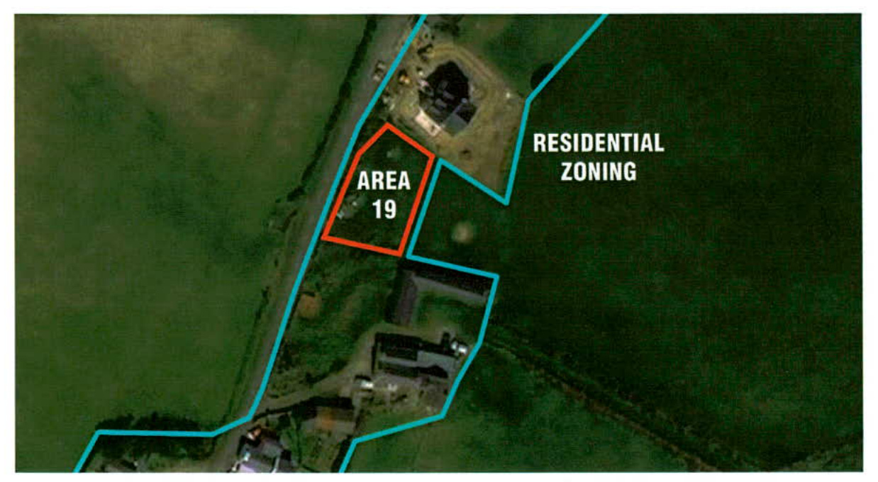 An aerial site plan highlighting a specific plot labeled 'Area 19' in red, situated within a larger blue-outlined 'Residential Zoning' area containing existing buildings.