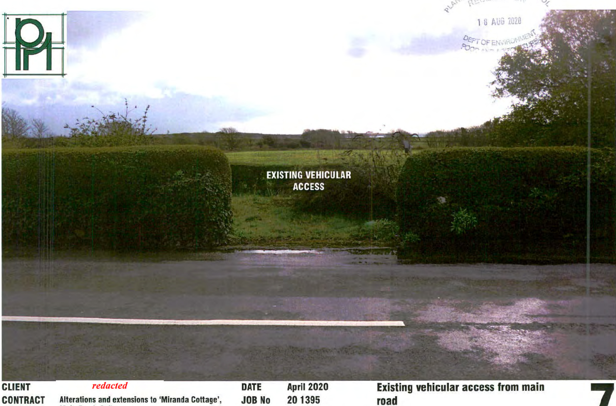 A photograph showing the existing vehicular access point to the property, viewed from the road through a gap in the hedges.
