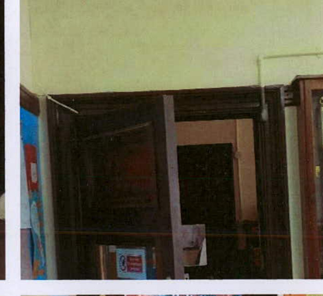 A photograph showing an interior view of a dark wooden door frame and archway with pale yellow walls, likely documenting existing conditions for building consent.