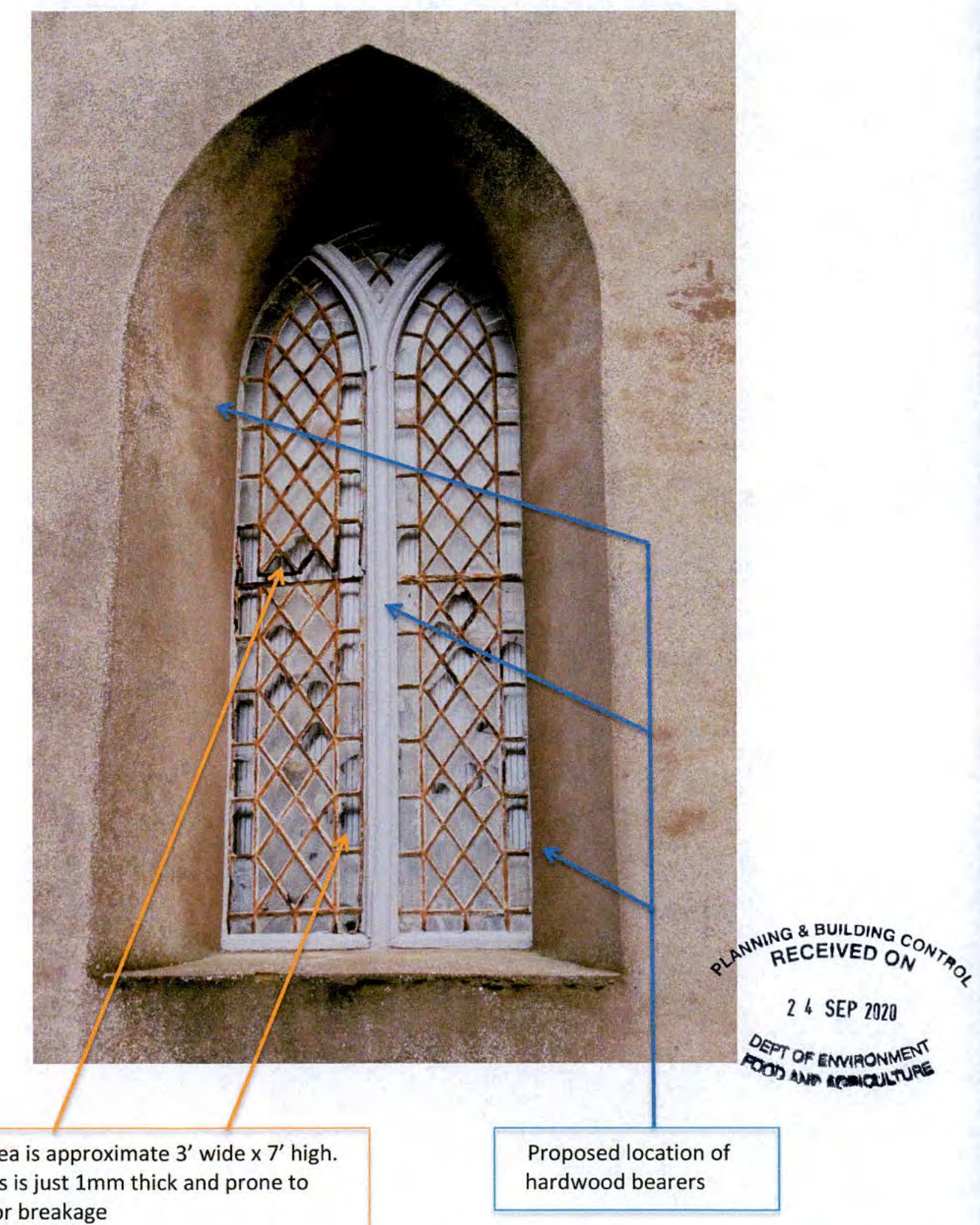 An annotated photograph of a historic arched stone window with diamond-patterned glazing, showing repair details and measurements.