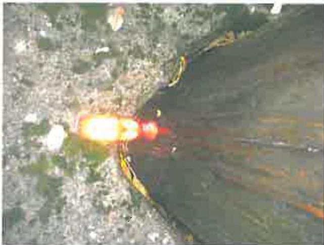A low-resolution, blurry image resembling a site plan or map with a bright glare obscuring the center.