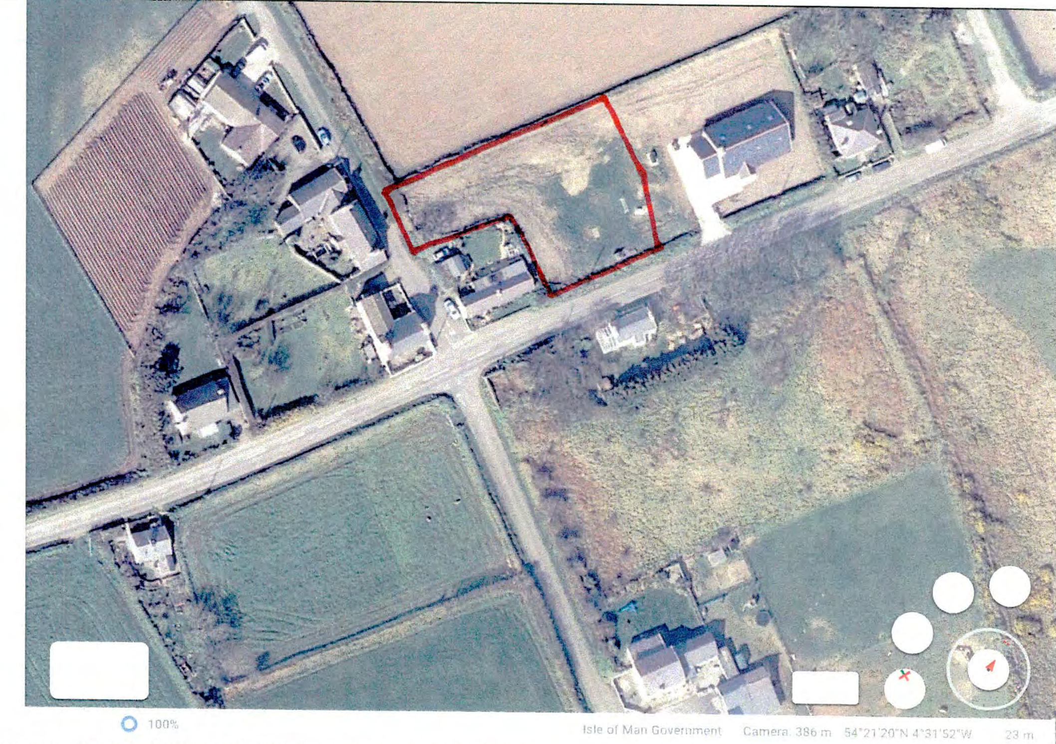 An aerial site location map showing a specific plot of land outlined in red, situated in a rural area with surrounding houses and fields.