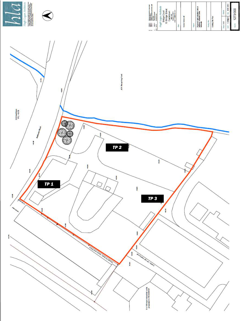 A site plan showing the proposed layout for industrial units with a watercourse boundary and tree preservation areas.