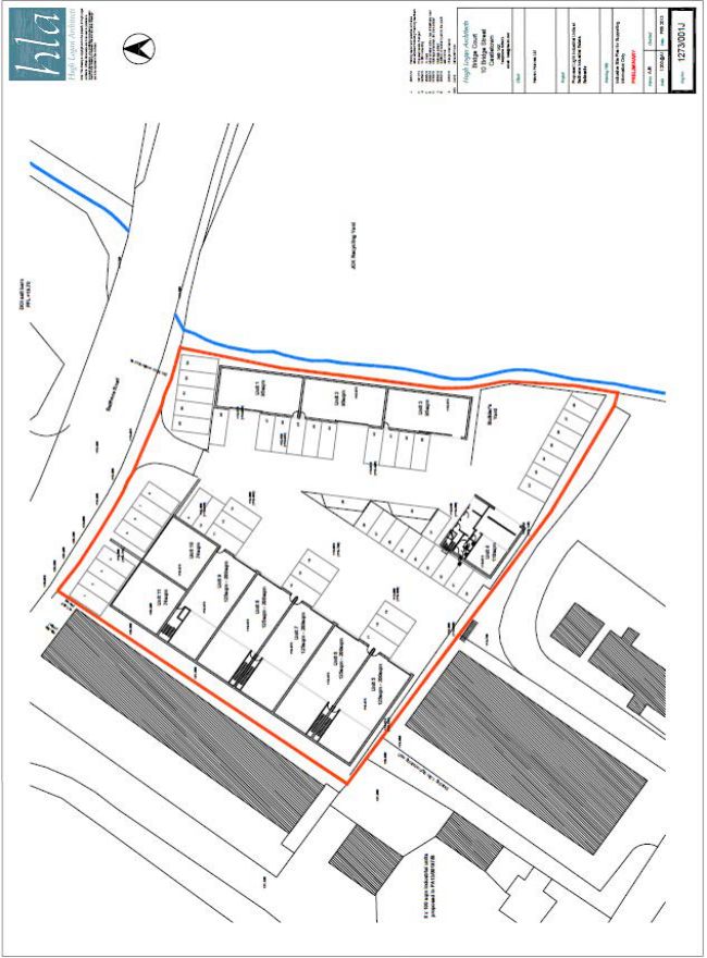 Site plan showing the layout of 11 industrial units, parking spaces, and a stream boundary marked in blue.