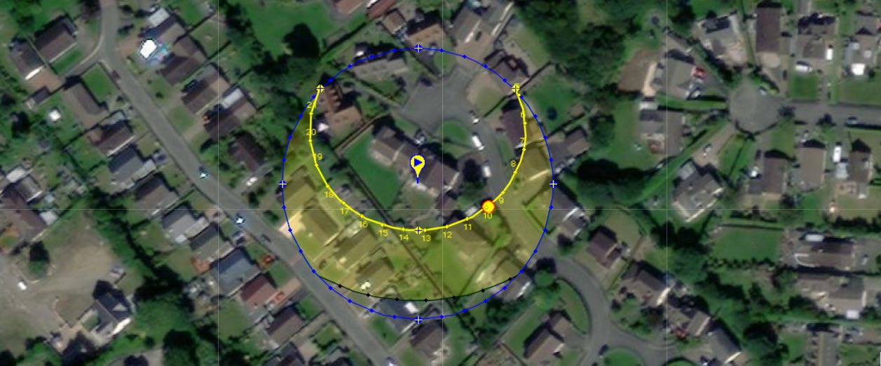 An aerial site map of a residential area featuring a blue sun path analysis circle and yellow arc overlay.