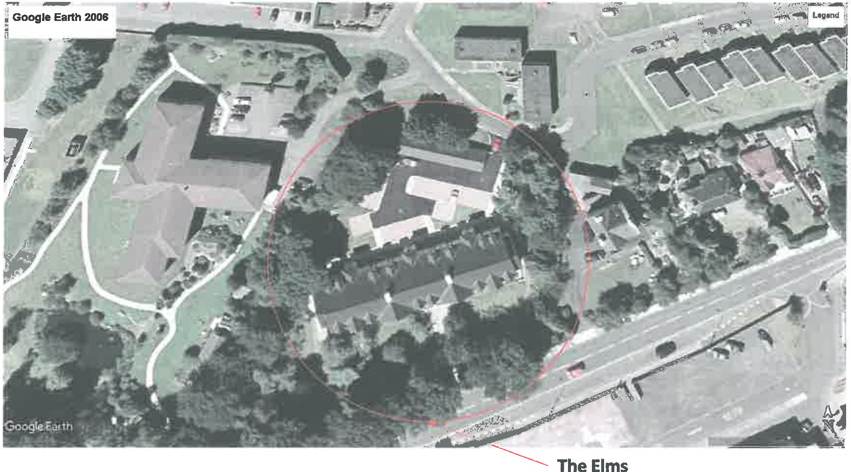 An aerial satellite view from Google Earth (2006) showing a property circled in red labeled 'The Elms' situated near a road and other buildings.